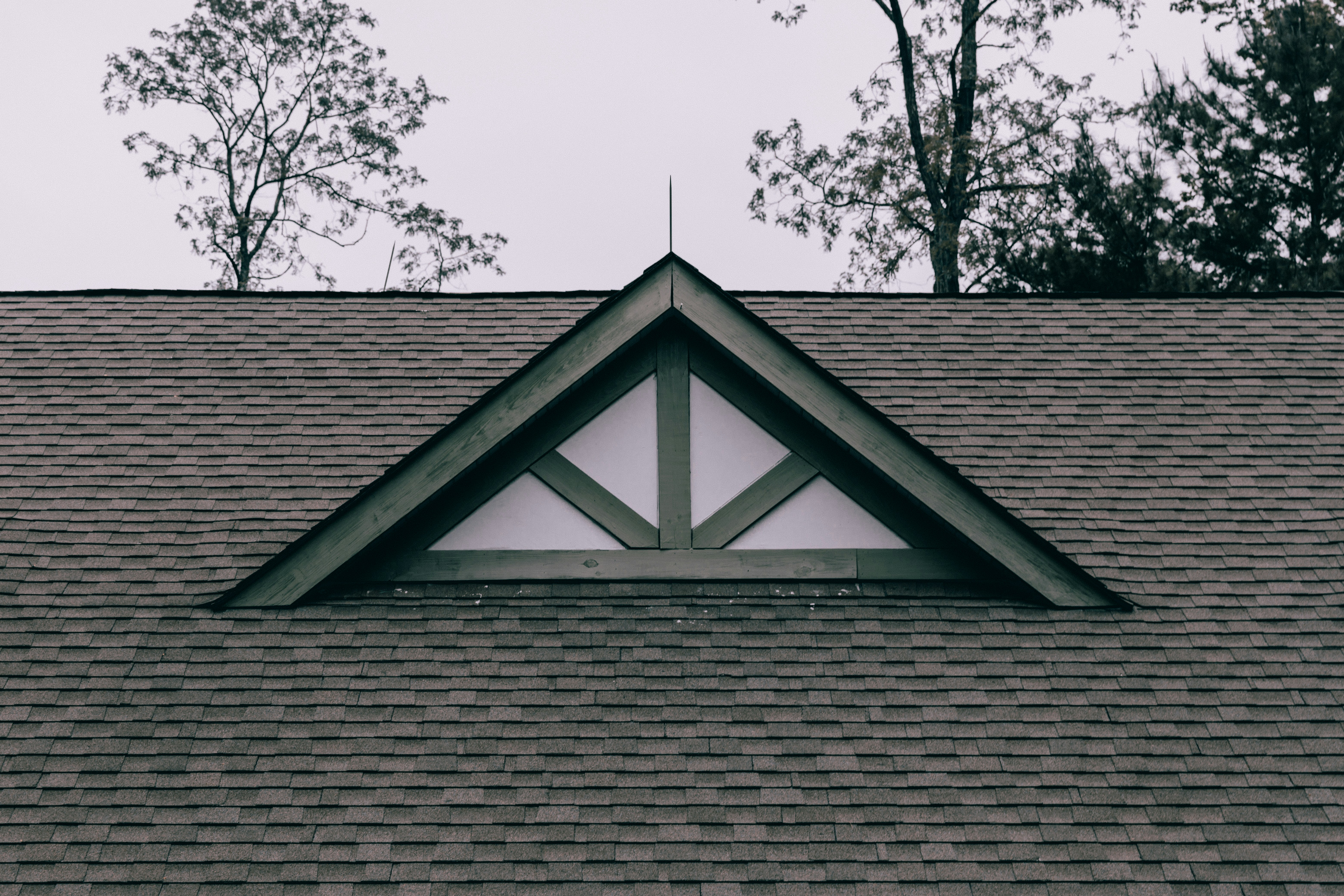 Finished shingle roof with a decorative timber gable
